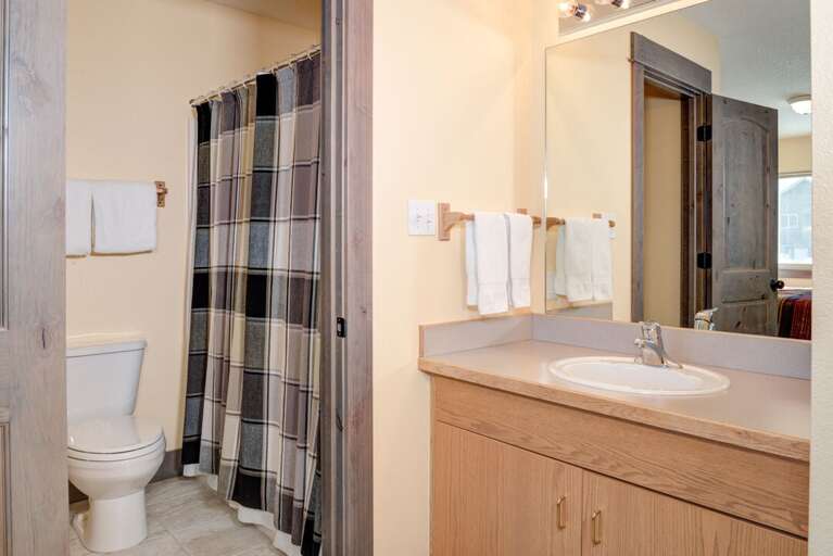 Enjoy the separate bath and vanity spaces | Upper Level