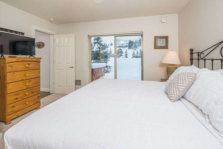 Primary Bedroom | Access to Backyard and Private Hot Tub | King-sized Bed | Main Level