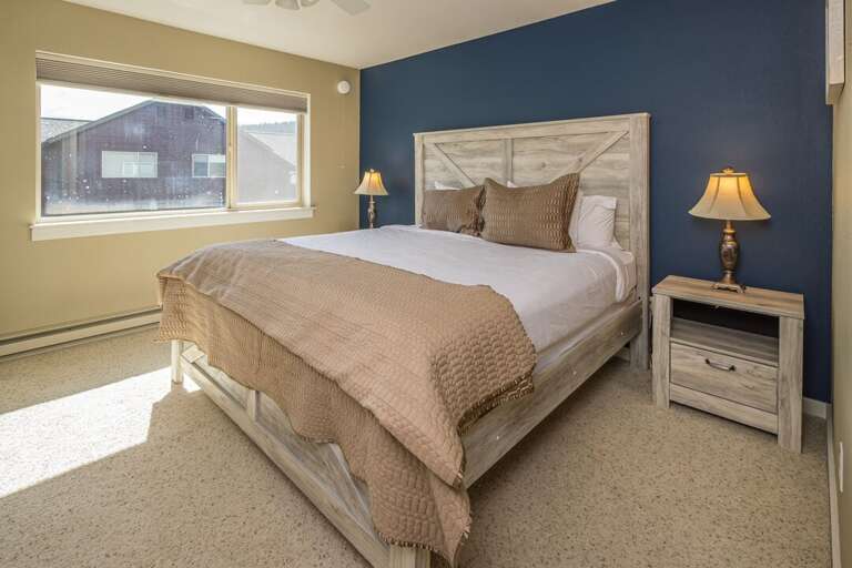 Cozy up in the king-sized bed | Upper Level