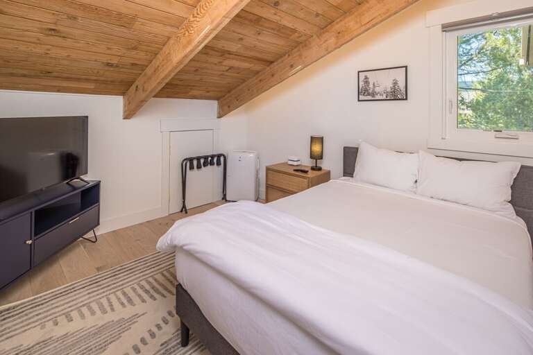 The second bedroom has a comfortable queen-sized bed. The second bedroom has a comfortable queen-sized bed.