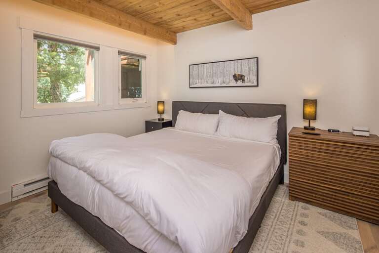 Cozy up in this main level bedroom with a king-sized bed. Cozy up in this main level bedroom with a king-sized bed.