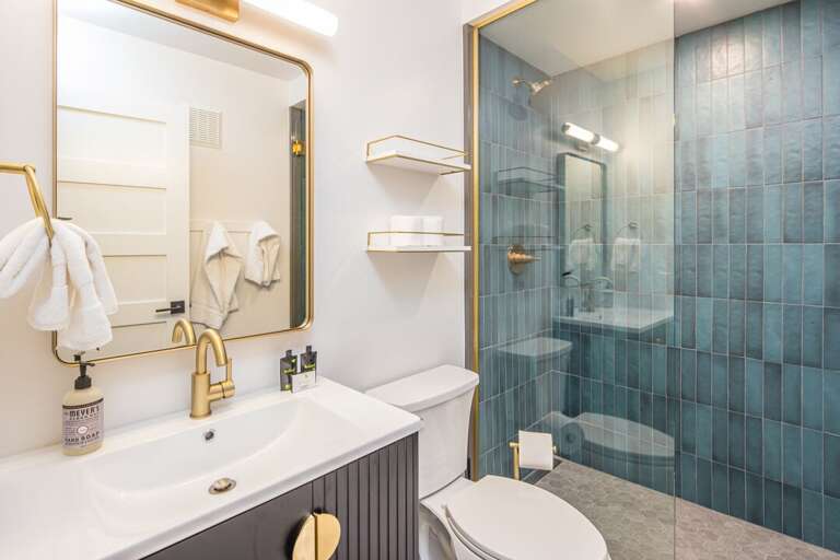 The main level bathroom has a gorgeous teal shower! The main level bathroom has a gorgeous teal shower!