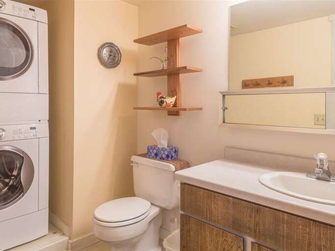 Enjoy the convenient half-bath and laundry | Main Level