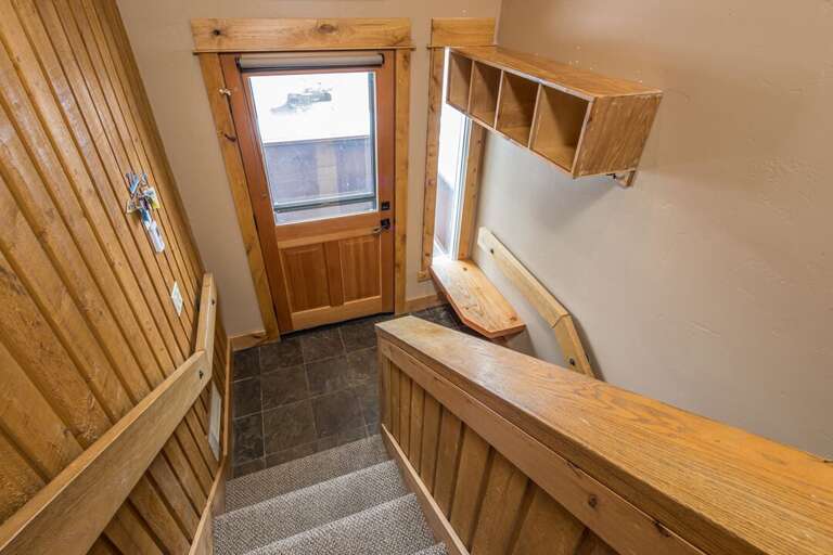 Staircase to Front Entry & to Lower Level Staircase to Front Entry & to Lower Level