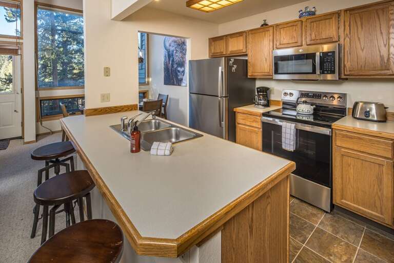 Vacation Rental Kitchen With Spacious Counters And Shiny Appliances