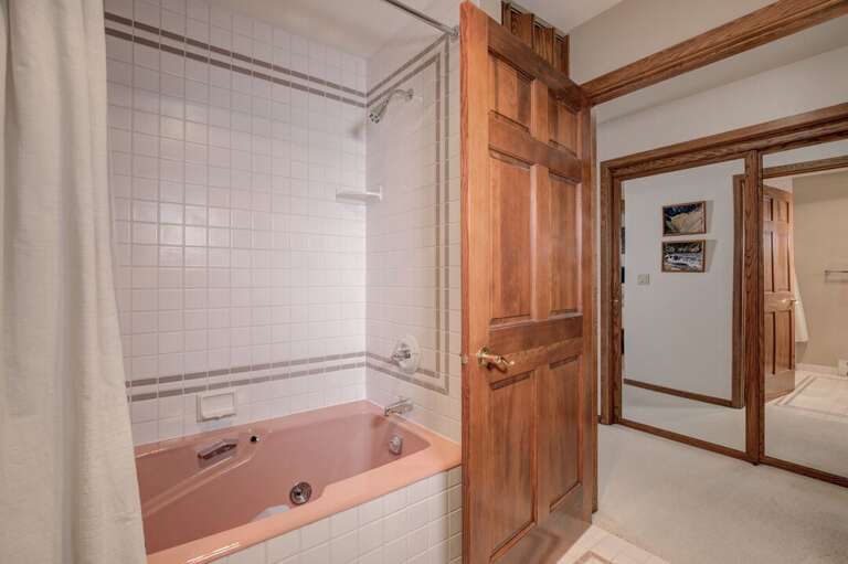 Enjoy the pink touches in the bathroom | Main Level Enjoy the pink touches in the bathroom | Main Level