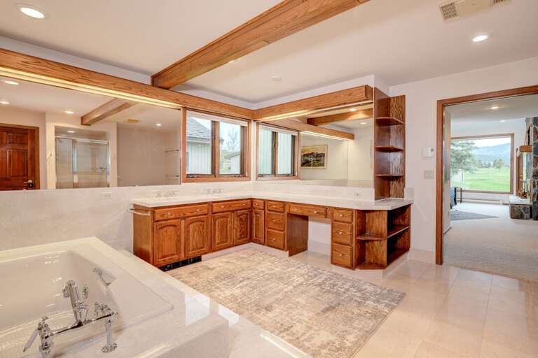 Enjoy the spacious ensuite bathroom | Main Level Enjoy the spacious ensuite bathroom | Main Level