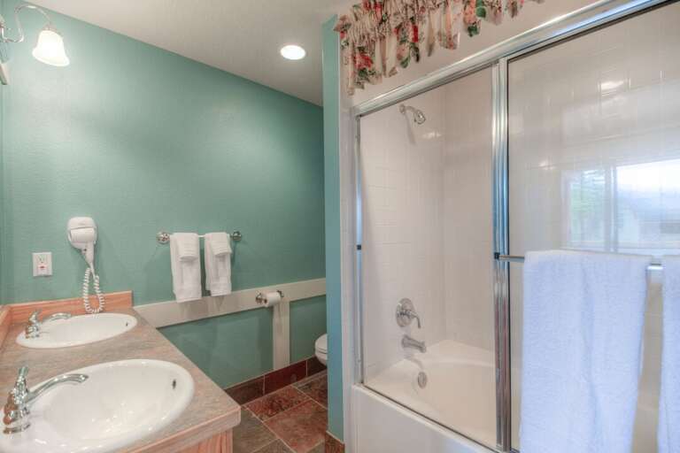 The master has an ensuite bathroom with a double vanity and a big tub/shower | Lower Level The master has an ensuite bathroom with a double vanity and a big tub/shower | Lower Level