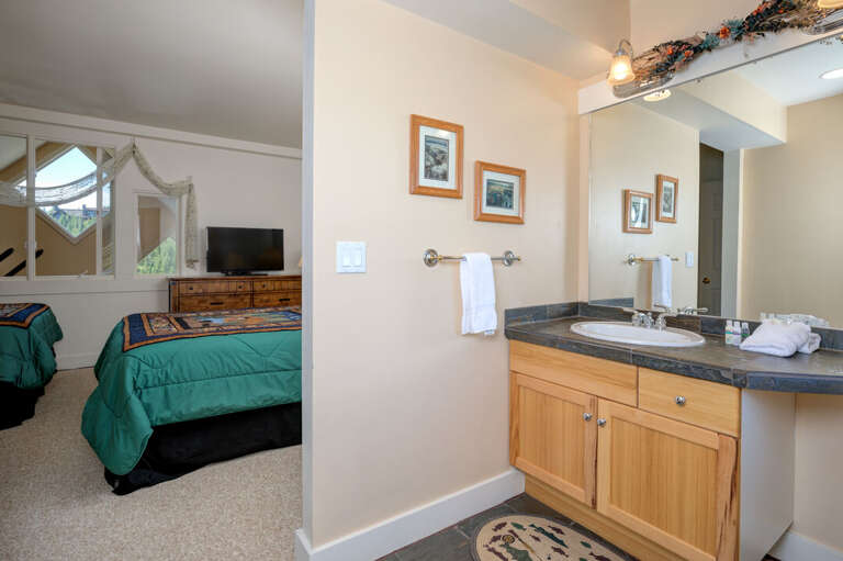 The ensuite bathroom is convenient for guests | Lower Level