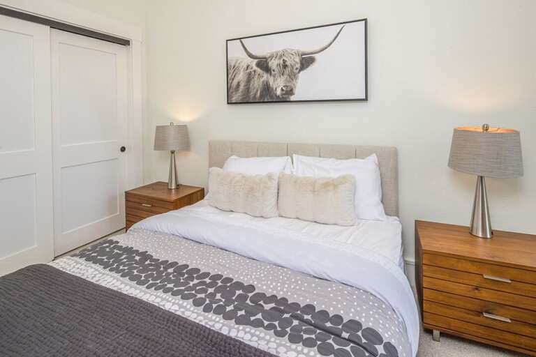 Lower-level bedroom with a comfortable bed!