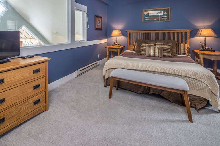 Get cozy in the king-sized bed | Upper Level