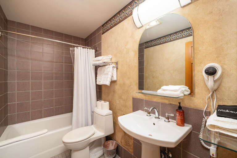 Ensuite bathroom in the bedroom with tub/shower combo | Main Level