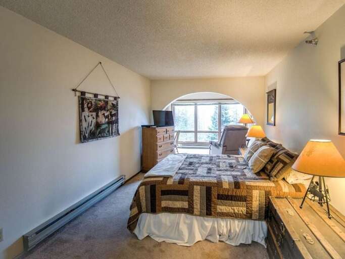 Get comfy in the king-sized bed | Main Level Get comfy in the king-sized bed | Main Level