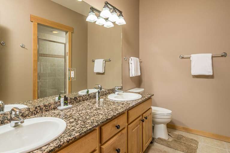 Shared bathroom with standing shower | Upper Level