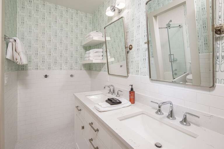 Dual vanity in the 2nd shared bathroom right outside the 2nd queen bedroom | Upper Level