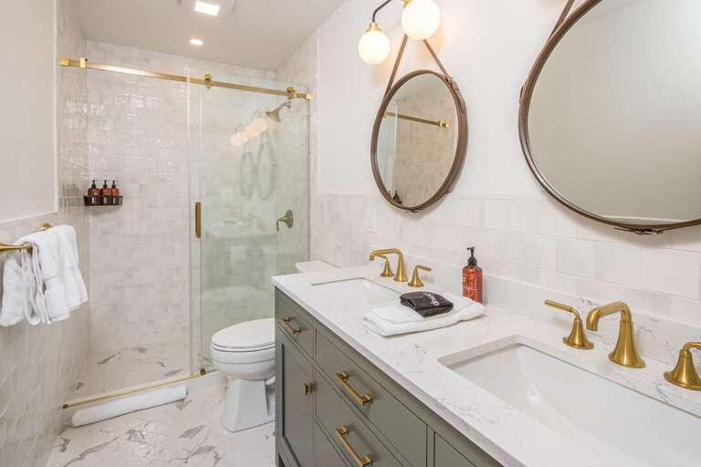 Dual vanity and walk-in shower in ensuite bathroom | Upper Level