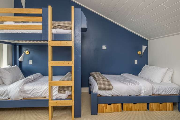 Twin-over-twin bunk bed with a twin single bed | East Loft