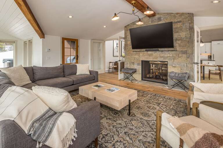 Unbeatable living space with ample seating and access to the hot tub patio | Upper Level