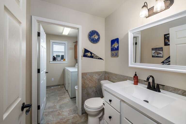 Half bathroom on the main level that is also connected to the laundry area.