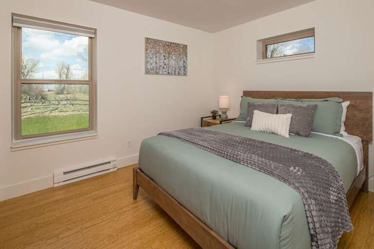 Bedroom 1: Queen Bed with Views | Main Level Bedroom 1: Queen Bed with Views | Main Level