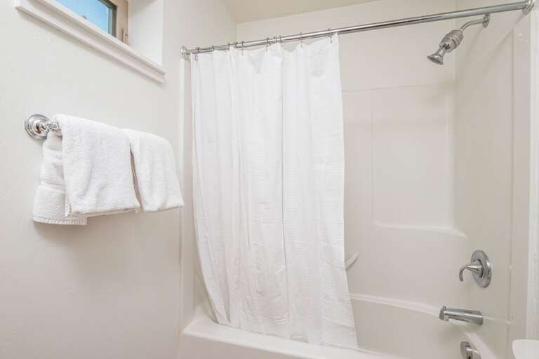 Spotless White Bathroom to rinse off the dust | Main Level Spotless White Bathroom to rinse off the dust | Main Level
