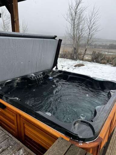 Outdoor Jacuzzi On Snowy Deck