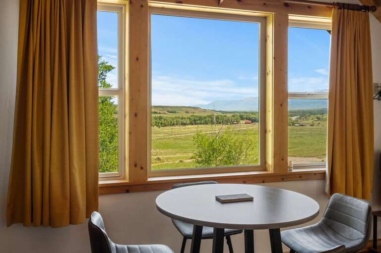 Seating for four to take in the views | Guest Suite | Upper Level Seating for four to take in the views | Guest Suite | Upper Level