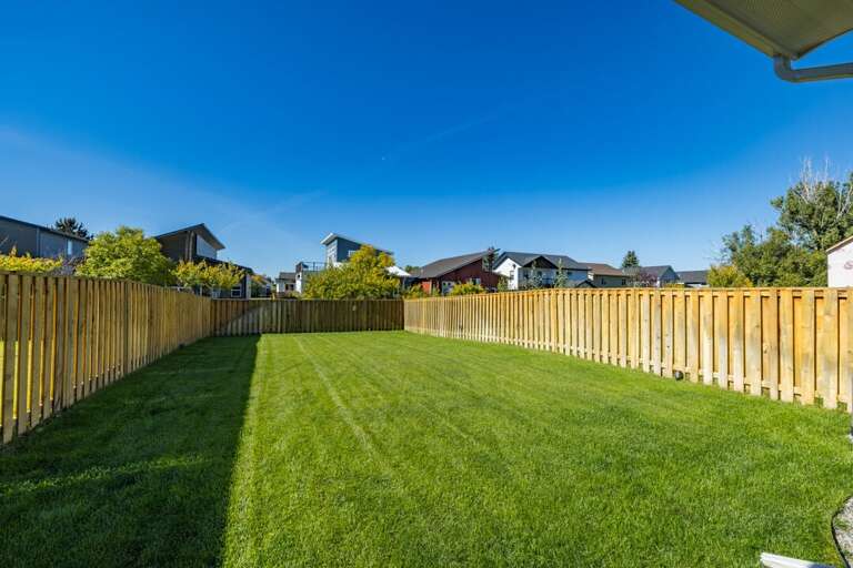 Enjoy Playing out in this Spacious Backyard | Exterior Enjoy Playing out in this Spacious Backyard | Exterior