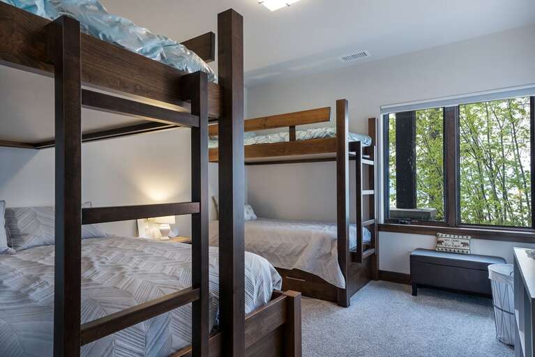 Bedroom 4 is located on the lower level and can sleep up to 5! Great room for the kids! | Two Twin over Queen bunks