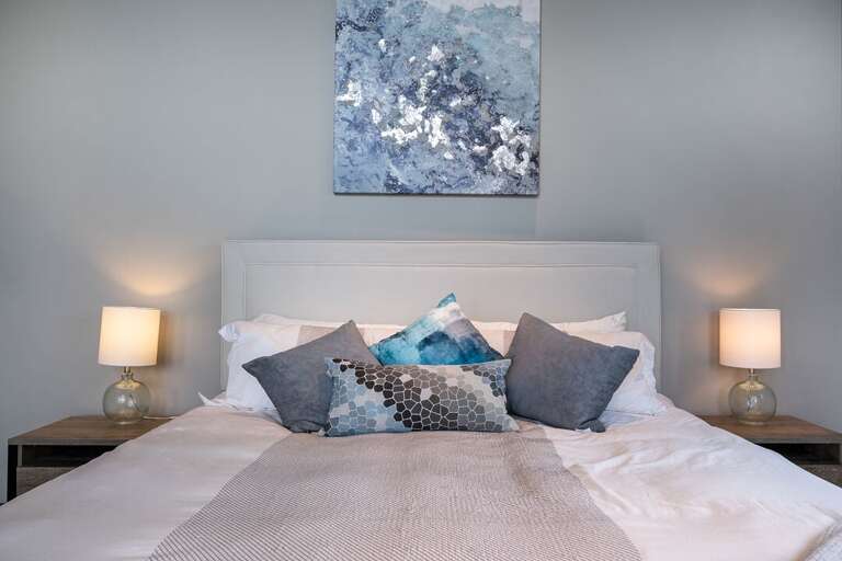 Master Bedroom 1 is located on the main level with access to the patio! | King Bed