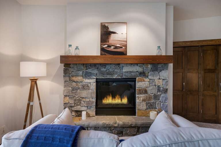 Master Bedroom 3 is located on the lower level with a private patio, private ensuite and a gas fireplace!