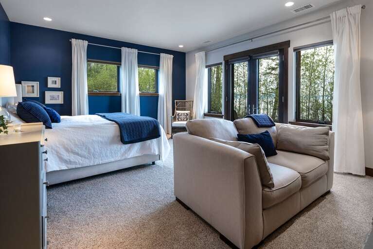 Master Bedroom 3 is located on the lower level with a private patio, private ensuite and a gas fireplace! | King Bed
