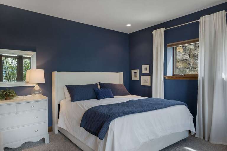 Master Bedroom 3 is located on the lower level with a private patio, private ensuite and a gas fireplace! | King Bed