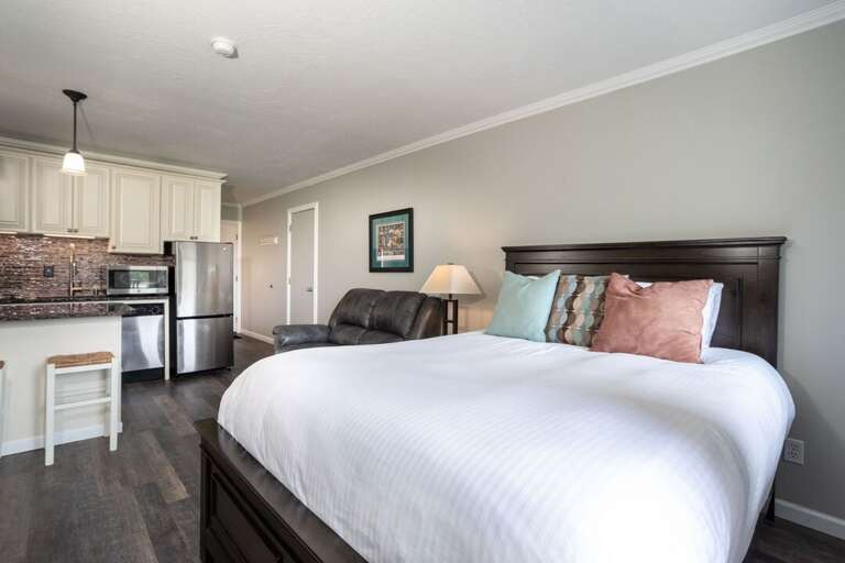 The king-sized bed is comfy and great for a peaceful night's sleep. The king-sized bed is comfy and great for a peaceful night's sleep.