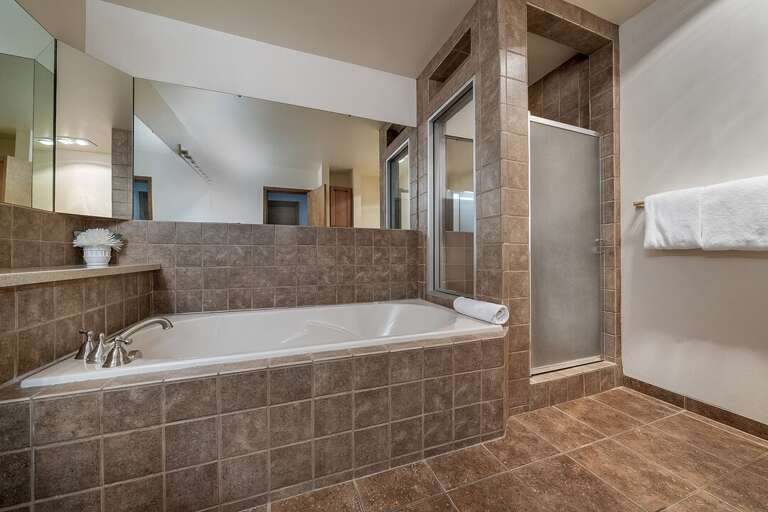 Enjoy the jetted tub and walk-in shower | Main Level
