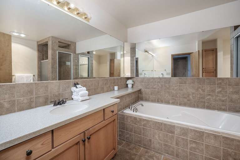 The mirrors make the bathroom feel even bigger than it is! | Main Level