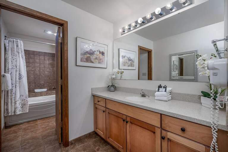 The separate vanity and shower room makes getting ready convenient | Upper Level