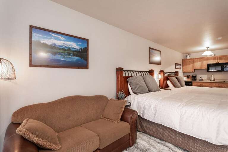 Relax on the couch |  2 Queen-Sized Beds | Main Level