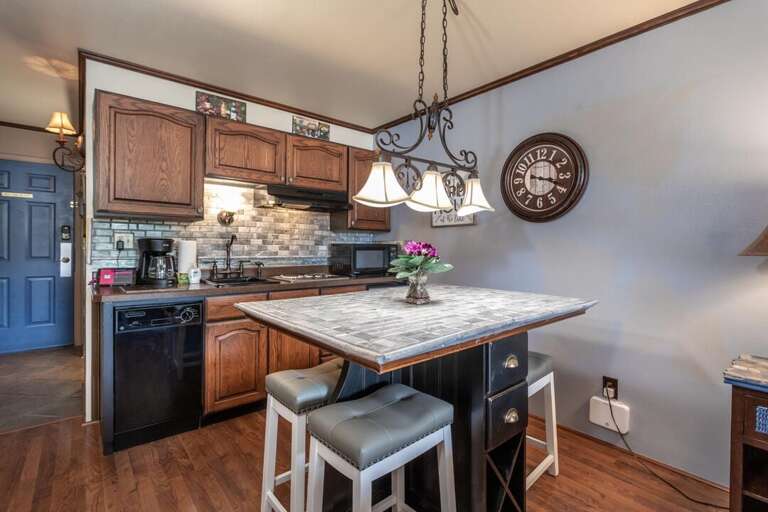 The dining area comfortably seats 4, perfect for entertaining.