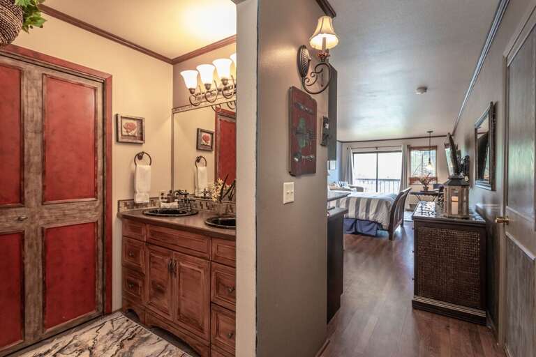 The vanity is separate from the shower/tub/toilet, making it very convenient.