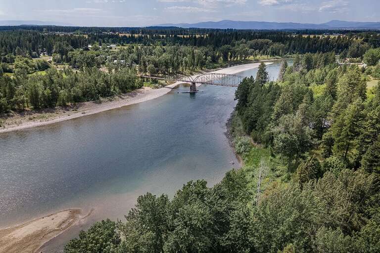Mountains behind the beautiful river | Aerial