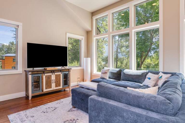 Enjoy a Movie or the Views From the Living Room | Upper Level