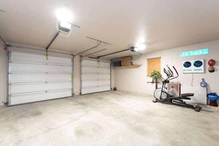 Two car garage with workout equipment | Main Level Two car garage with workout equipment | Main Level