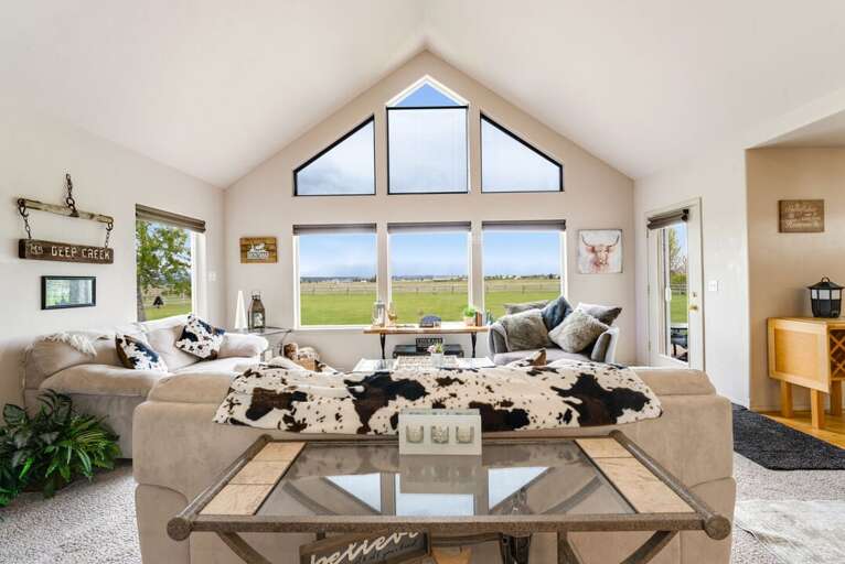 The living room is perfect for playing board games or relaxing | Main Level The living room is perfect for playing board games or relaxing | Main Level