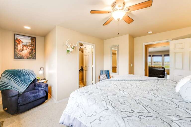 Relax in bed or cosy up on the chair | Main Level Relax in bed or cosy up on the chair | Main Level