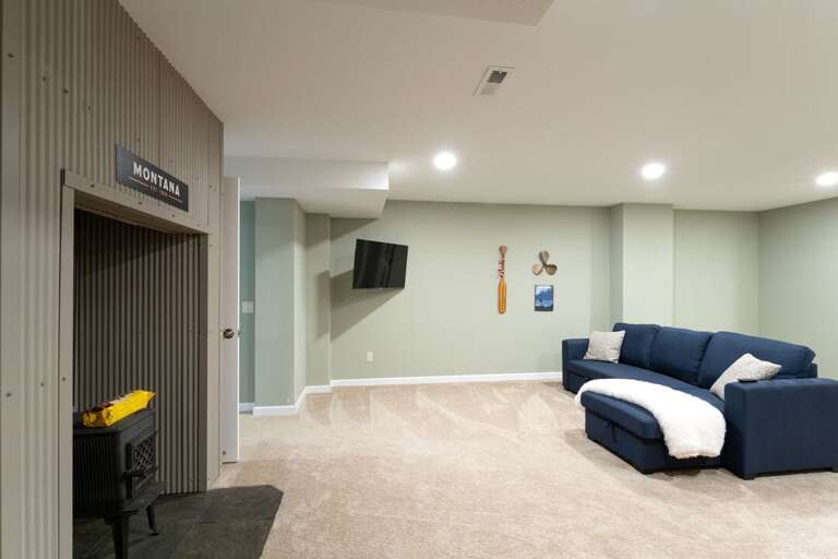 Unique fireplace to heat up the space | Lower Level