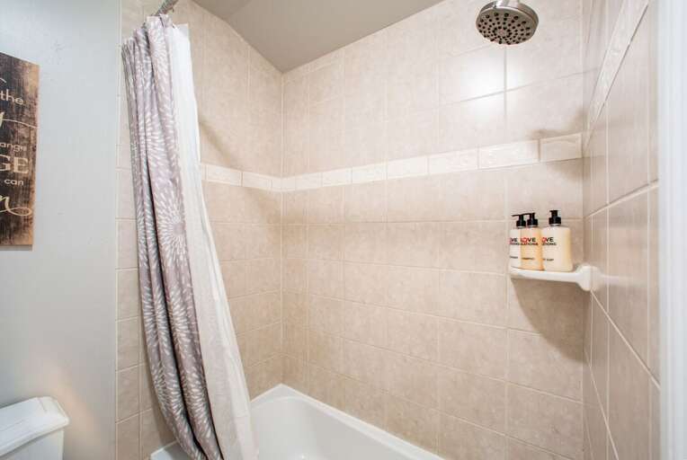 Full Shared Bath 1 with a Separate Tub/Shower Combo | Main Level Full Shared Bath 1 with a Separate Tub/Shower Combo | Main Level