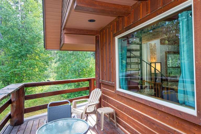 Enjoy dinner on the balcony, surrounded by trees and wildlife on a cool summer night | Exterior