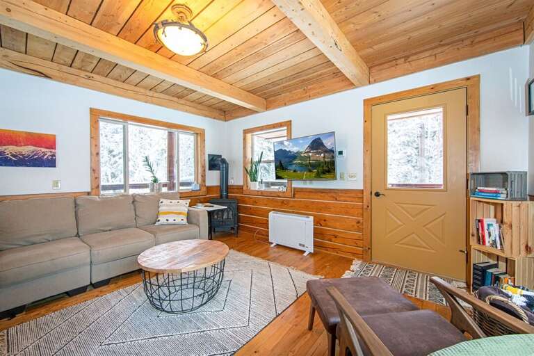 Two gas fireplaces provide warmth & ambiance to this charming cabin in the woods | Main Level