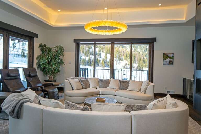 The accordion-style doors framing the living room open up for a seamless transition between the indoors & outdoors | Main Level